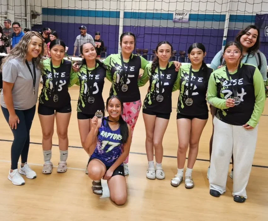 Raptors Rise 14U players and coaches at a volleyball tournament